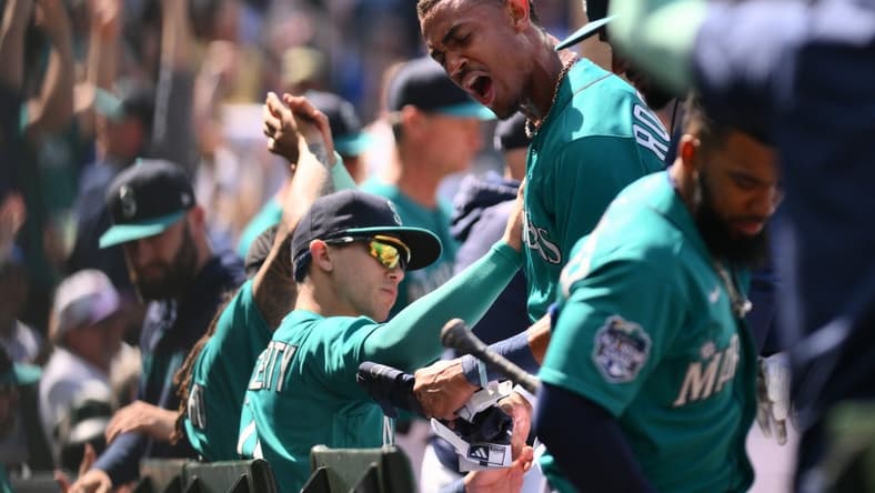 May 27, 2023; Seattle, Washington, USA; Seattle Mariners center fielder Julio Rodriguez (44) reacts to scoring a run against the Pittsburgh Pirates during the sixth inning at T-Mobile Park. Mandatory Credit: Steven Bisig-USA TODAY Sports