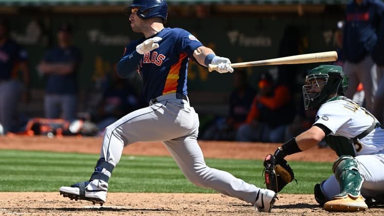 May 27, 2023; Oakland, California, USA; Houston Astros infielder Alex Bregman (2) hits an RBI double against the Oakland Athletics during the eighth inning at Oakland-Alameda County Coliseum. Mandatory Credit: Robert Edwards-USA TODAY Sports