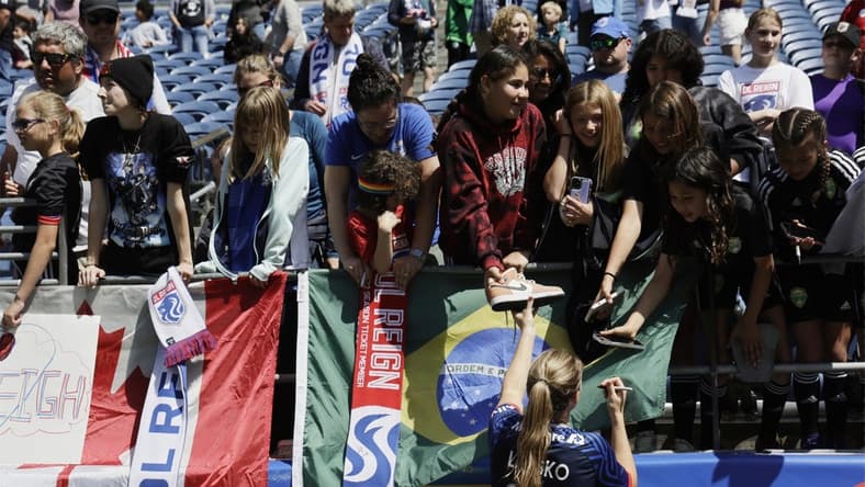 May 27, 2023; Seattle, Washington, USA; OL Reign forward Veronica Latsko (24) shakes hands with fans after the match against Angel City FC at Lumen Field. Mandatory Credit: John Froschauer-USA TODAY Sports