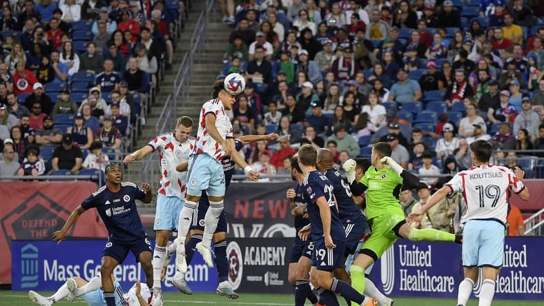 May 27, 2023; Foxborough, Massachusetts, USA; Chicago Fire defender Kendall Burks (27) heads the ball against the New England Revolution during the first half at Gillette Stadium. Mandatory Credit: Bob DeChiara-USA TODAY Sports