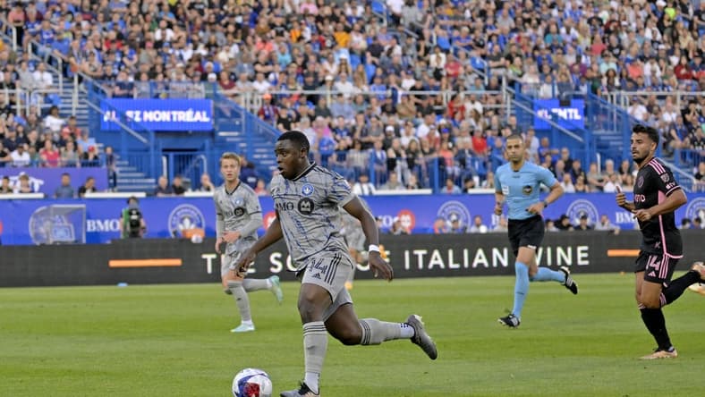 May 27, 2023; Montreal, Quebec, CAN; CF Montreal forward Sunusi Ibrahim (14) dribbles the ball against Inter Miami during the first half at Stade Saputo. Mandatory Credit: Eric Bolte-USA TODAY Sports