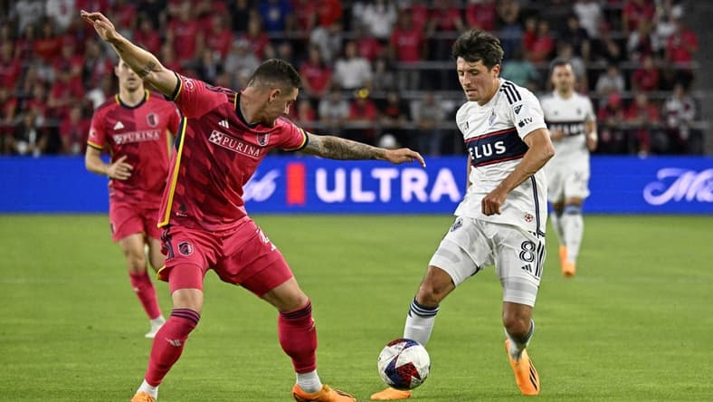 May 27, 2023; St. Louis, Missouri, USA; Vancouver Whitecaps midfielder Alessandro Schopf (8) dribbles the ball against St. Louis CITY SC defender Jake Nerwinski (2) during the first half at CITYPARK. Mandatory Credit: Scott Rovak-USA TODAY Sports