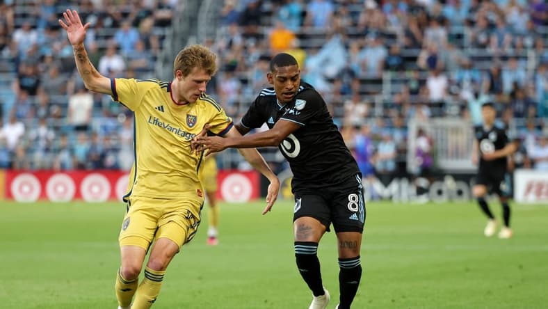May 27, 2023; Saint Paul, Minnesota, USA; Real Salt Lake midfielder Bode Hidalgo (19) battles for the ball against Minnesota United midfielder Joseph Rosales (8) during the first half lat Allianz Field. Mandatory Credit: Matt Krohn-USA TODAY Sports