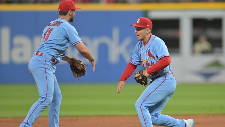 May 27, 2023; Cleveland, Ohio, USA; St. Louis Cardinals shortstop Paul DeJong (11) and second baseman Tommy Edman (19) celebrate after the Cardinals beat the Cleveland Guardians at Progressive Field. Mandatory Credit: Ken Blaze-USA TODAY Sports