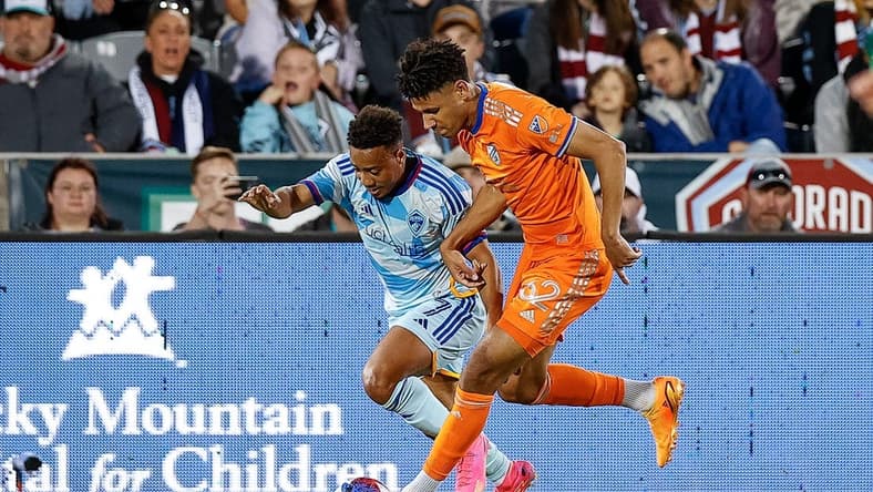 May 27, 2023; Commerce City, Colorado, USA; FC Cincinnati defender Ian Murphy (32) and Colorado Rapids forward Jonathan Lewis (7) battle for the ball in the first half at Dick's Sporting Goods Park. Mandatory Credit: Isaiah J. Downing-USA TODAY Sports
