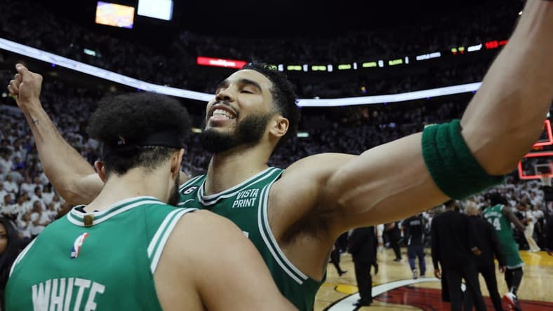 May 27, 2023; Miami, Florida, USA; Boston Celtics guard Derrick White (9) celebrates with forward Jayson Tatum (0) after defeating the Miami Heat in game six of the Eastern Conference Finals for the 2023 NBA playoffs at Kaseya Center. Mandatory Credit: Sam Navarro-USA TODAY Sports