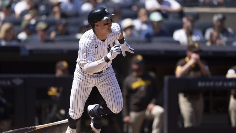 May 28, 2023; Bronx, New York, USA; New York Yankees shortstop Anthony Volpe (11) hits an RBI single against the San Diego Padres during the third inning at Yankee Stadium. Mandatory Credit: Gregory Fisher-USA TODAY Sports