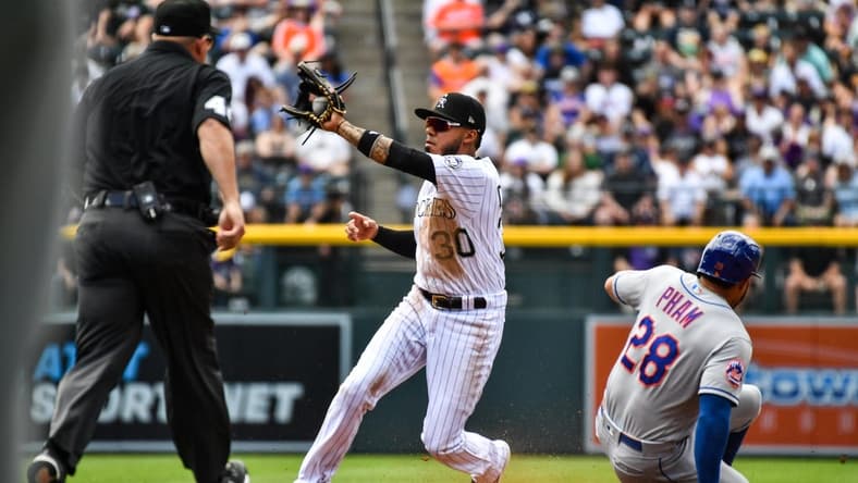 May 28, 2023; Denver, Colorado, USA; New York Mets left fielder Tommy Pham (28) steals second as Colorado Rockies second baseman Harold Castro (30) gets the throw late in the second inning at Coors Field. Mandatory Credit: John Leyba-USA TODAY Sports