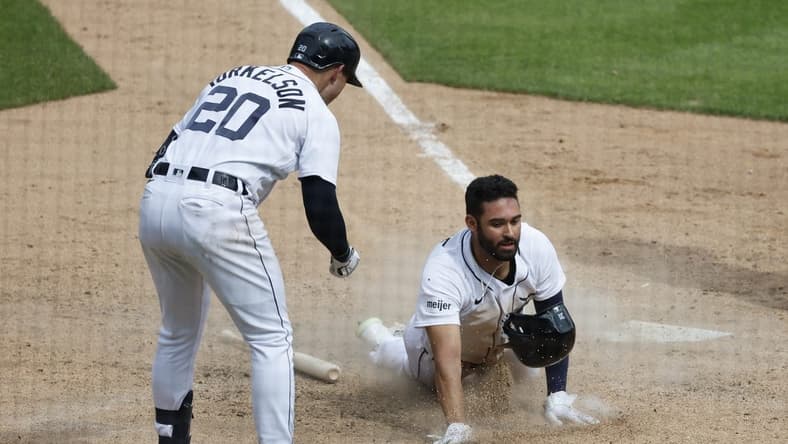 May 28, 2023; Detroit, Michigan, USA; Detroit Tigers center fielder Riley Greene (31) slides in safe at home in the eighth inning against the Chicago White Sox at Comerica Park. Mandatory Credit: Rick Osentoski-USA TODAY Sports