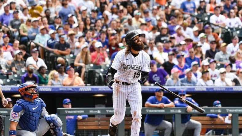 May 28, 2023; Denver, Colorado, USA; Colorado Rockies designated hitter Charlie Blackmon (19) hits a 374 ft home run in the fifth inning against the New York Mets at Coors Field. Mandatory Credit: John Leyba-USA TODAY Sports