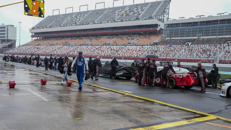 May 29, 2023; Concord, North Carolina, USA; Cars are pushed back to the garage area after NASCAR cancels the Alsco Uniforms 300 at Charlotte Motor Speedway. Mandatory Credit: Jim Dedmon-USA TODAY Sports