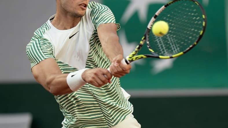 May 29, 2023; Paris,France; Carlos Alcaraz (ESP) returns a shot during his match against Flavio Cobolli (ITA) on day two at Stade Roland-Garros. Mandatory Credit: Susan Mullane-USA TODAY Sports