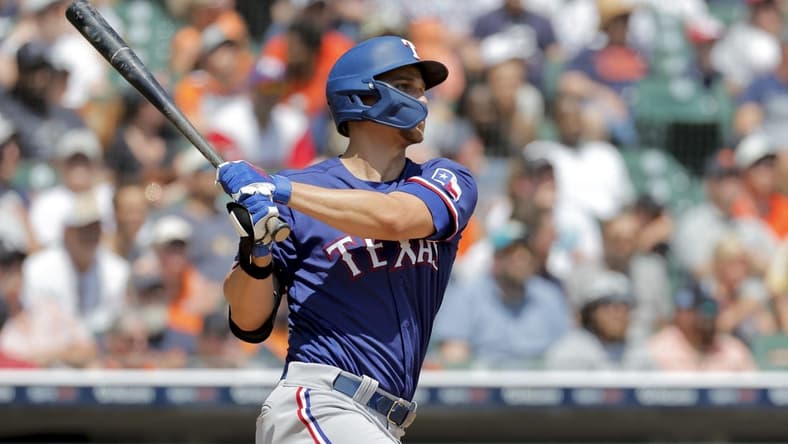 May 29, 2023; Detroit, Michigan, USA;  Texas Rangers shortstop Corey Seager (5) hits a three run home run in the fifth inning against the Detroit Tigers at Comerica Park. Mandatory Credit: Rick Osentoski-USA TODAY Sports