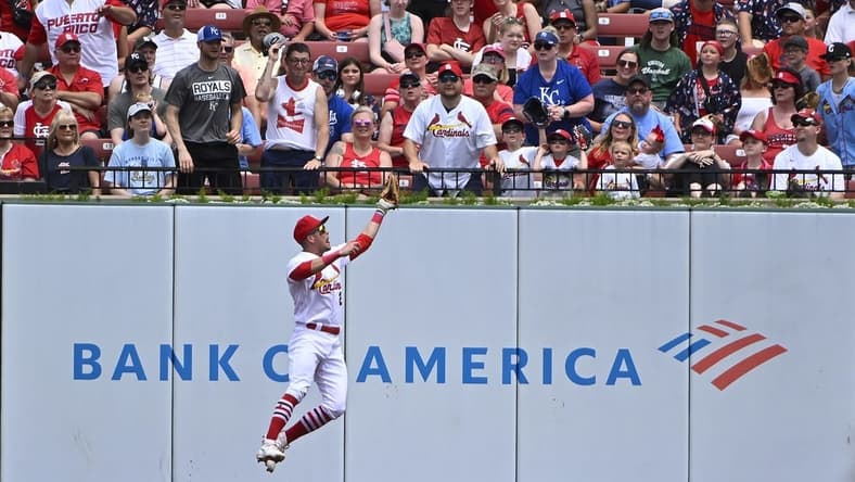 May 29, 2023; St. Louis, Missouri, USA;  St. Louis Cardinals center fielder Lars Nootbaar (21) leaps at the wall and catches a fly ball hit by Kansas City Royals second baseman Michael Massey (not pictured) during the second inning at Busch Stadium. Mandatory Credit: Jeff Curry-USA TODAY Sports