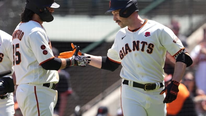 May 29, 2023; San Francisco, California, USA; San Francisco Giants left fielder Austin Slater (right) celebrates with shortstop Brandon Crawford (left) after hitting a home run against the Pittsburgh Pirates during the second inning at Oracle Park. Mandatory Credit: Darren Yamashita-USA TODAY Sports