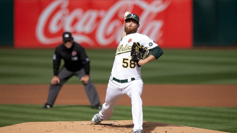 May 29, 2023; Oakland, California, USA; Oakland Athletics starting pitcher Paul Blackburn (58) delivers a pitch against the Atlanta Braves during the first inning at Oakland-Alameda County Coliseum. Mandatory Credit: D. Ross Cameron-USA TODAY Sports