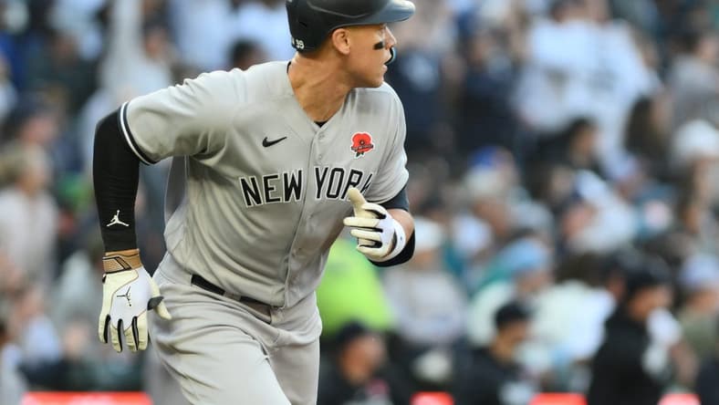May 29, 2023; Seattle, Washington, USA; New York Yankees right fielder Aaron Judge (99) runs towards first base after hitting a 2-run home run against the Seattle Mariners during the third inning at T-Mobile Park. Mandatory Credit: Steven Bisig-USA TODAY Sports