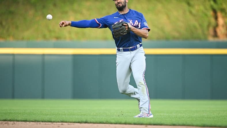 May 30, 2023; Detroit, Michigan, USA; Texas Rangers second baseman Marcus Semien (2) makes a throw during the fifth inning against the Detroit Tigers at Comerica Park. Mandatory Credit: Tim Fuller-USA TODAY Sports