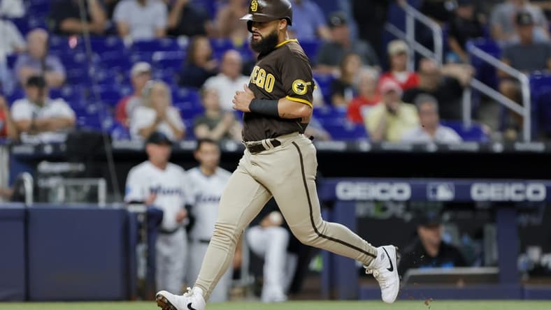 May 30, 2023; Miami, Florida, USA; San Diego Padres second baseman Rougned Odor (24) scores after an RBI double by designated hitter Matt Carpenter (not pictured) during the fourth inning at loanDepot Park. Mandatory Credit: Sam Navarro-USA TODAY Sports