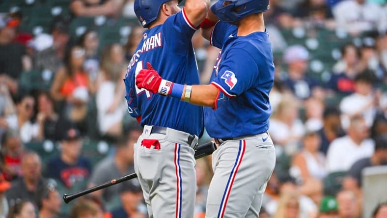 May 30, 2023; Detroit, Michigan, USA; Texas Rangers third baseman Josh Jung (6) celebrates his two run home run with designated hitter Robbie Grossman (4) during the seventh inning against the Detroit Tigers at Comerica Park. Mandatory Credit: Tim Fuller-USA TODAY Sports