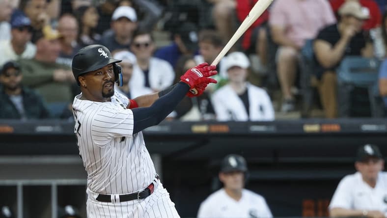 May 30, 2023; Chicago, Illinois, USA; Chicago White Sox designated hitter Eloy Jimenez (74) hits an RBI sacrifice fly against the Los Angeles Angels during the first inning at Guaranteed Rate Field. Mandatory Credit: Kamil Krzaczynski-USA TODAY Sports