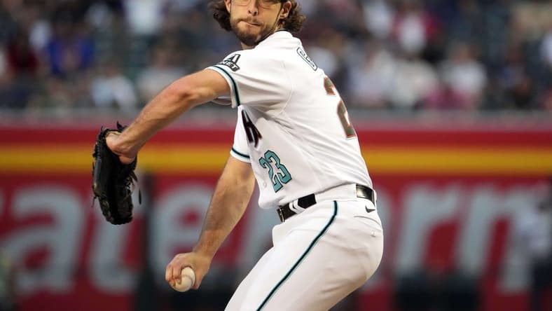 May 30, 2023; Phoenix, Arizona, USA; Arizona Diamondbacks starting pitcher Zac Gallen (23) pitches against the Colorado Rockies during the third inning at Chase Field. Mandatory Credit: Joe Camporeale-USA TODAY Sports