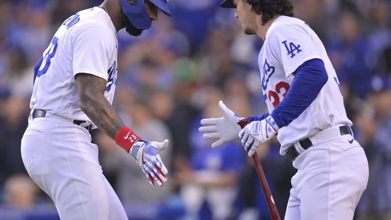 May 30, 2023; Los Angeles, California, USA; Los Angeles Dodgers right fielder Jason Heyward (23) celebrates with center fielder James Outman (33) after hitting a solo home run in the second inning against the Washington Nationals at Dodger Stadium. Mandatory Credit: Jayne Kamin-Oncea-USA TODAY Sports