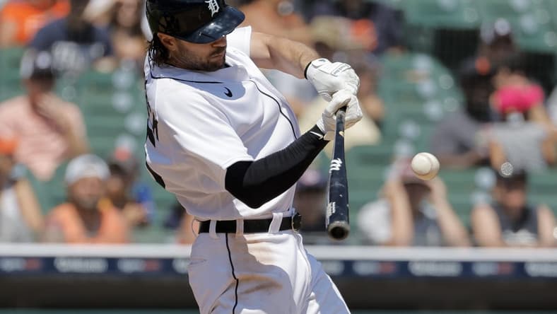 May 31, 2023; Detroit, Michigan, USA; Detroit Tigers left fielder Jake Marisnick (15) hits an RBI single in the sixth inning against the Texas Rangers at Comerica Park. Mandatory Credit: Rick Osentoski-USA TODAY Sports