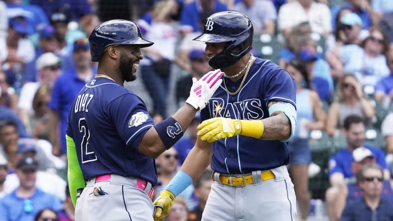 May 31, 2023; Chicago, Illinois, USA; Tampa Bay Rays center fielder Jose Siri (22) is greeted by first baseman Yandy Diaz (2) after hitting a two-run homer against the Chicago Cubs during the eighth inning at Wrigley Field. Mandatory Credit: David Banks-USA TODAY Sports
