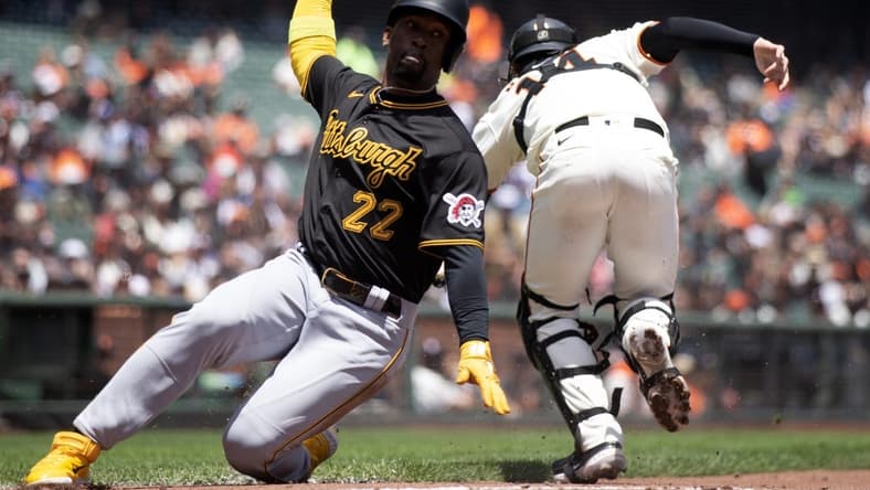 May 31, 2023; San Francisco, California, USA; Pittsburgh Pirates designated hitter Andrew McCutchen (22) slides safely home on a single by Rodolfo Castro as San Francisco Giants catcher Patrick Bailey (14) during the third inning at Oracle Park. Mandatory Credit: D. Ross Cameron-USA TODAY Sports