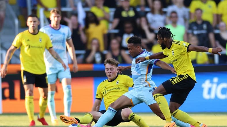 May 31, 2023; Columbus, Ohio, USA; Colorado Rapids forward Jonathan Lewis (7) dribbles the ball against the Columbus Crew SC midfielder Aidan Morris (8) and Columbus Crew SC defender Steven Moreira (31) at Lower.com Field. Mandatory Credit: Trevor Ruszkowski-USA TODAY Sports