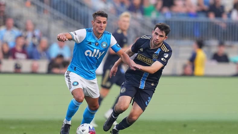 May 31, 2023; Chester, Pennsylvania, USA; Charlotte FC midfielder Ashley Westwood (8) controls the ball against Philadelphia Union midfielder Leon Flach (31) in the first half at Subaru Park. Mandatory Credit: Mitchell Leff-USA TODAY Sports