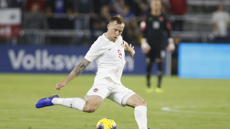 Nov 15, 2019; Orlando, FL, USA; Canada midfielder Scott Arfield (8) kicks the ball against the the United States during the first half of a CONCACAF Nations League soccer match at Exploria Stadium. Mandatory Credit: Reinhold Matay-USA TODAY Sports