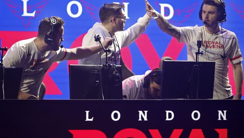 Jan 25, 2020; Minneapolis, Minnesota, USA; Matthew Skrapz Marshall and Dylan Henderson and Rhys Rated Price of the London Royal Ravens celebrate after defeating the New York Subliners during the Call of Duty League Launch Weekend at The Armory. Mandatory Credit: Bruce Kluckhohn-USA TODAY Sports