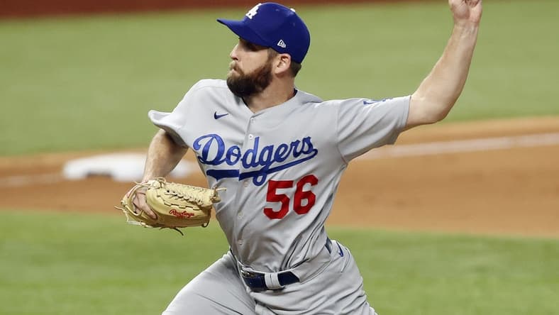 Oct 14, 2020; Arlington, Texas, USA; Los Angeles Dodgers relief pitcher Adam Kolarek (56) throws against the Atlanta Braves during the ninth inning of game three of the 2020 NLCS at Globe Life Field. Mandatory Credit: Tim Heitman-USA TODAY Sports