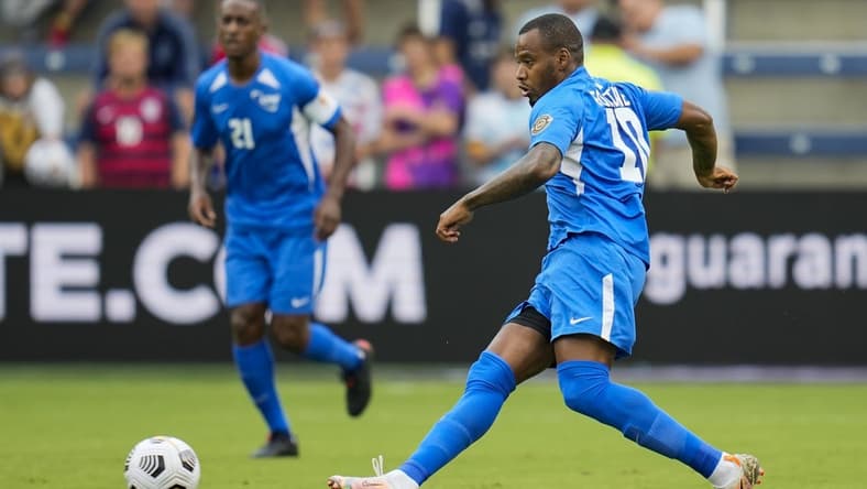Jul 11, 2021; Kansas City, Kansas, USA; Martinique forward Kevin Fortune (10) passes the ball against Canada in the first half during a CONCACAF Gold Cup group stage soccer match at Children's Mercy Park. Mandatory Credit: Jay Biggerstaff-USA TODAY Sports
