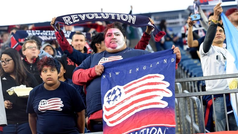 Apr 30, 2022; Foxborough, Massachusetts, USA; A New England Revolution fan holds a banner before a match against Inter Miami at Gillette Stadium. Mandatory Credit: Bob DeChiara-USA TODAY Sports
