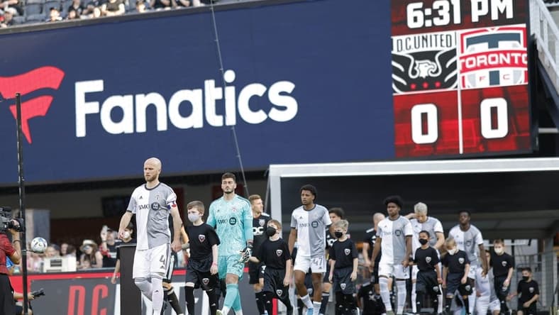 May 21, 2022; Washington, District of Columbia, USA; Toronto FC players and D.C. United players walk onto the pitch from the tunnel prior to their game at Audi Field. Mandatory Credit: Geoff Burke-USA TODAY Sports