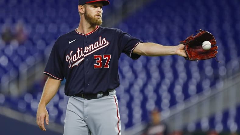 Jun 9, 2022; Miami, Florida, USA; Washington Nationals starting pitcher Stephen Strasburg (37) catches a baseball during the first inning against the Miami Marlins at loanDepot Park. Mandatory Credit: Sam Navarro-USA TODAY Sports