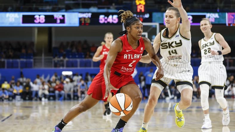 Jun 17, 2022; Chicago, Illinois, USA; Atlanta Dream guard Aari McDonald (2) drives to the basket against Chicago Sky guard Allie Quigley (14) during the first half of a WNBA game at Wintrust Arena. Mandatory Credit: Kamil Krzaczynski-USA TODAY Sports