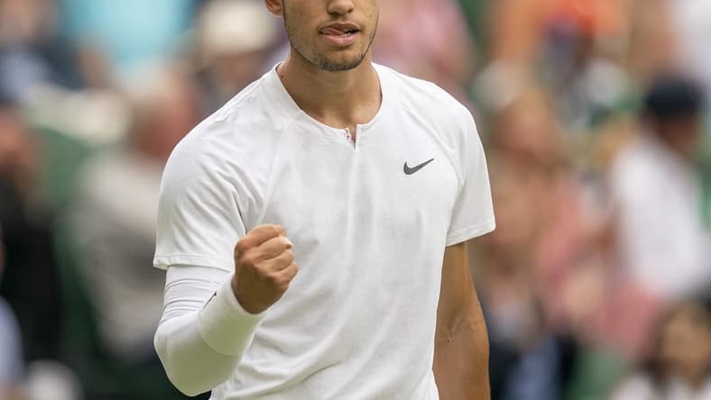 Jul 3, 2022; London, United Kingdom; Carlos Alcaraz (ESP) reacts to a point during his match against Jannik Sinner (ITA) on day seven at All England Lawn Tennis and Croquet Club. Mandatory Credit: Susan Mullane-USA TODAY Sports