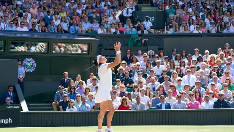 Jul 9, 2022; London, England, United Kingdom; Ons Jabeur (TUN) throws her racquet in the air in frustration during her women s singles final against Elena Rybakina (KAZ) on Centre court at All England Lawn Tennis and Croquet Club. Mandatory Credit: Peter van den Berg-USA TODAY Sports