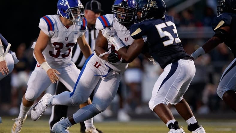 Dion Stutts (62) of MUS and Tre Jones (53) of Arlington  during the game between the Arlington Tigers and MUS Owls on Friday August, 19th 2022 in Arlington, Tn (Justin Ford/Special to the Commercial Appeal)

Arlingtonvsmus0020