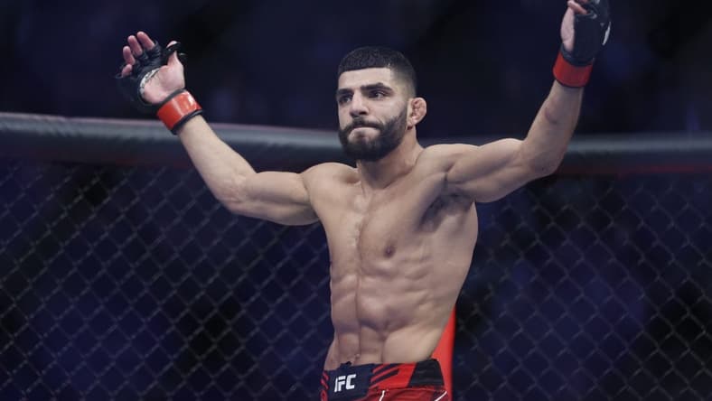 Aug 20, 2022; Salt Lake City, Utah, USA; Amir Albazi (red gloves) reacts after defeating Francisco Figueiredo (blue gloves) during UFC 278 at Vivint Arena. Mandatory Credit: Jeffrey Swinger-USA TODAY Sports
