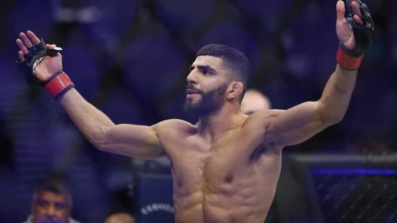 Aug 20, 2022; Salt Lake City, Utah, USA; Amir Albazi (red gloves) reacts after defeating Francisco Figueiredo (blue gloves) during UFC 278 at Vivint Arena. Mandatory Credit: Jeffrey Swinger-USA TODAY Sports
