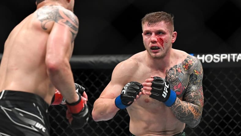 Sep 3, 2022; Paris, FRANCE; Robert Whittaker (red gloves) and Marvin Vettori (blue gloves) during UFC Fight Night at Accor Arena. Mandatory Credit: Per Haljestam-USA TODAY Sports