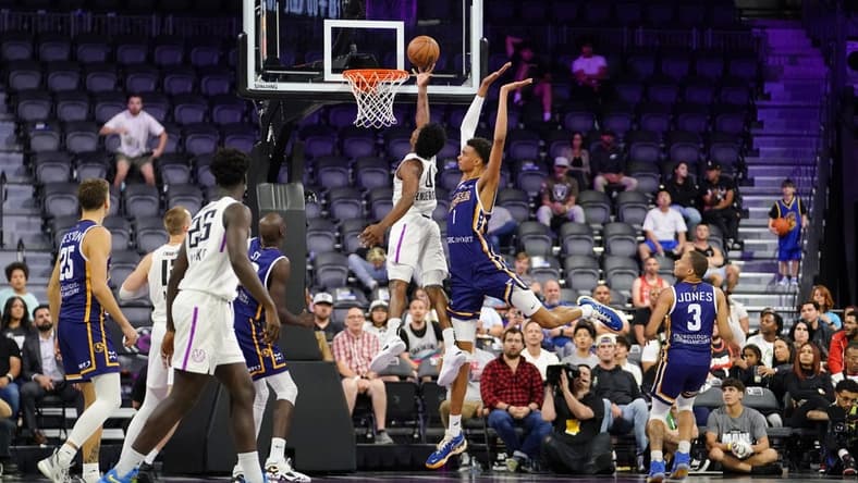 Oct 4, 2022; Henderson, NV, USA; NBA G League Ignite guard Scoot Henderson (0) scores a layup against Boulogne-Levallois Metropolitans 92 forward Victor Wembanyama (1) during the fourth quarter at The Dollar Loan Center. Mandatory Credit: Lucas Peltier-USA TODAY Sports