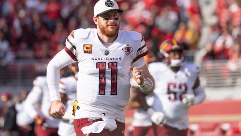 Dec 24, 2022; Santa Clara, California, USA; Washington Commanders quarterback Carson Wentz (11) runs onto the field before the start of the first quarter against the San Francisco 49ers at Levi's Stadium. Mandatory Credit: Stan Szeto-USA TODAY Sports