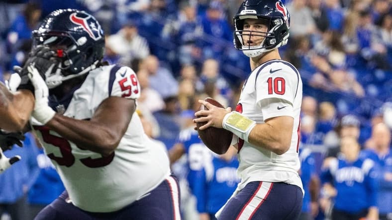 Jan 8, 2023; Indianapolis, Indiana, USA; Houston Texans quarterback Davis Mills (10) drops back to pass the ball in the first quarter against the Indianapolis Colts at Lucas Oil Stadium. Mandatory Credit: Trevor Ruszkowski-USA TODAY Sports