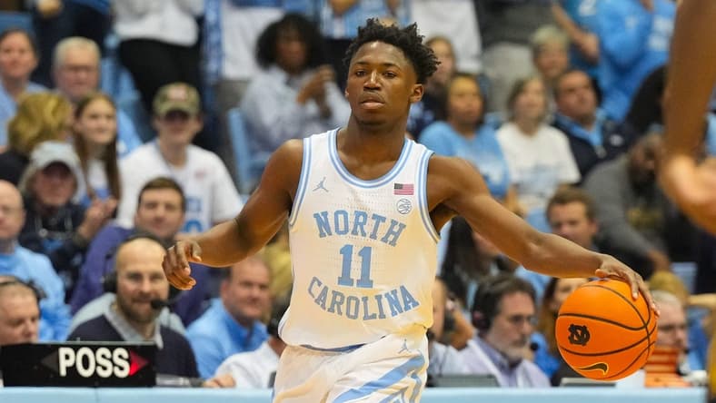 Jan 7, 2023; Chapel Hill, North Carolina, USA;  North Carolina Tar Heels guard D'Marco Dunn (11) dribbles the ball against the Notre Dame Fighting Irish during the second half at Dean E. Smith Center. Mandatory Credit: James Guillory-USA TODAY Sports